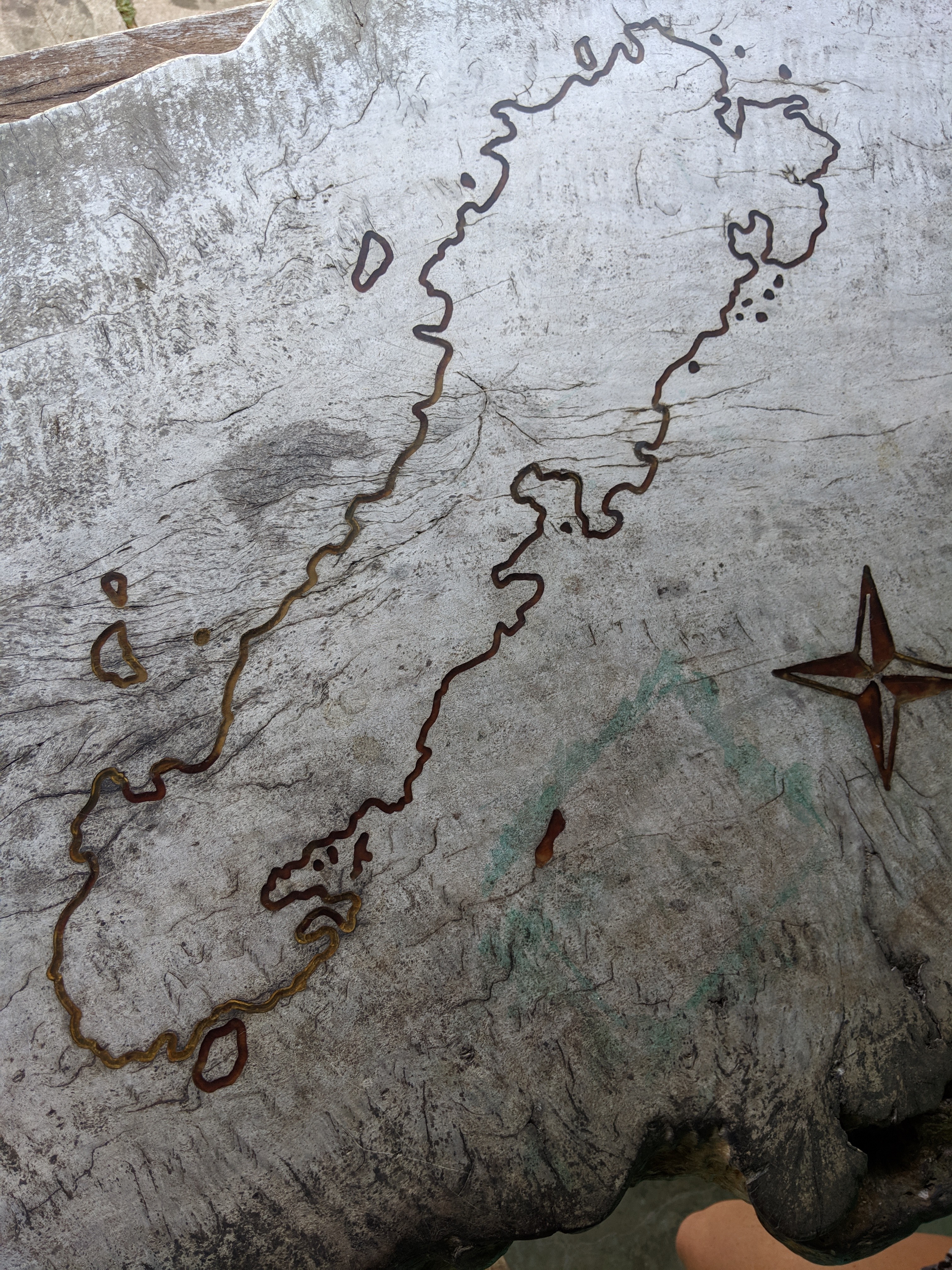 The island of Simeulue etched into the wooden table